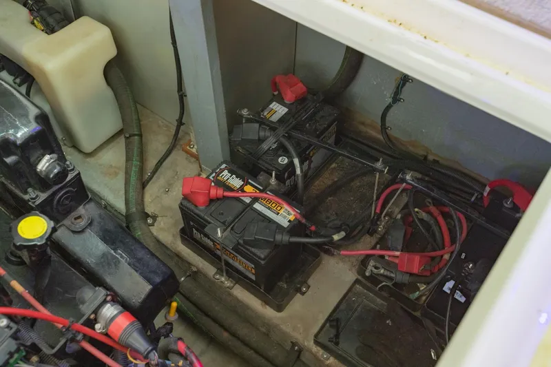 Just The Two Of Us Yacht Photos Pics Engine compartment of 1997 Sea Ray 400 Sundancer with batteries and wiring.