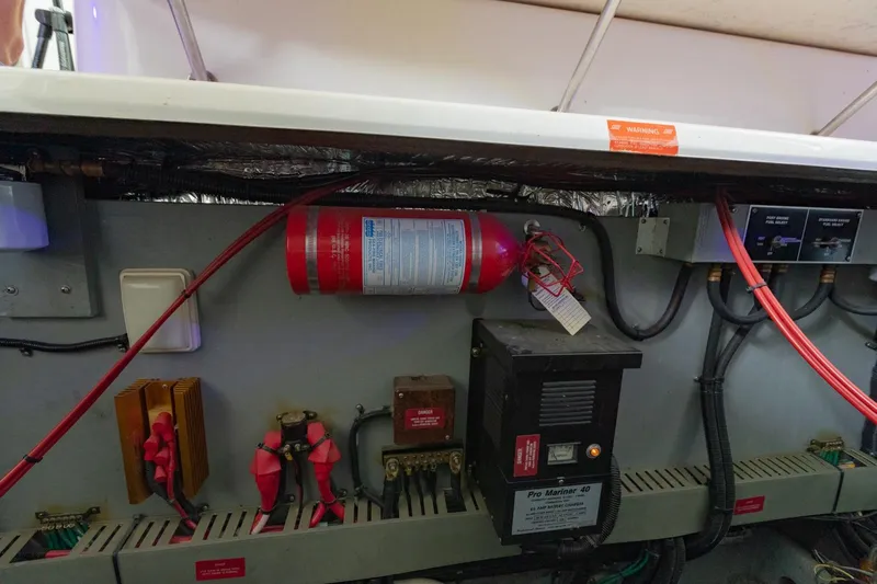 Just The Two Of Us Yacht Photos Pics Engine room of 1997 Sea Ray 400 Sundancer with fire extinguisher and electrical components.