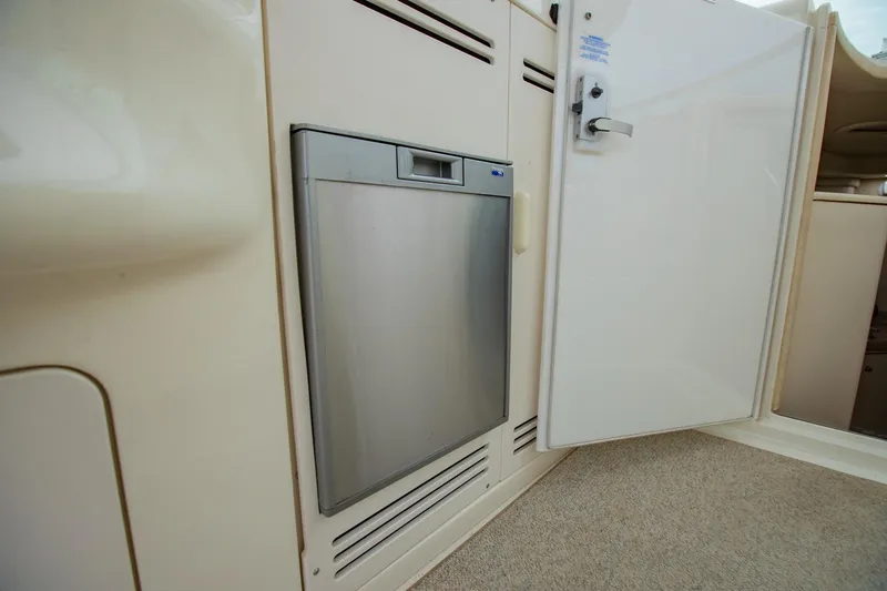 Just The Two Of Us Yacht Photos Pics 1997 Sea Ray 400 Sundancer interior with compact stainless steel refrigerator.