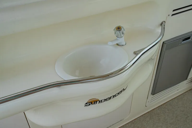 Just The Two Of Us Yacht Photos Pics 1997 Sea Ray 400 Sundancer yacht sink with faucet and Sundancer logo.