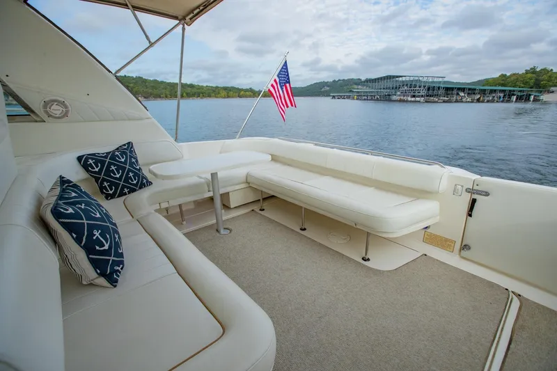 Just The Two Of Us Yacht Photos Pics Luxurious 1997 Sea Ray 400 Sundancer yacht interior with white seating and nautical pillows.