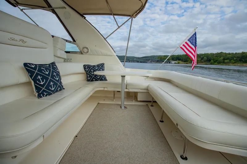 Just The Two Of Us Yacht Photos Pics 1997 Sea Ray 400 Sundancer yacht interior with anchor-themed cushions and American flag.