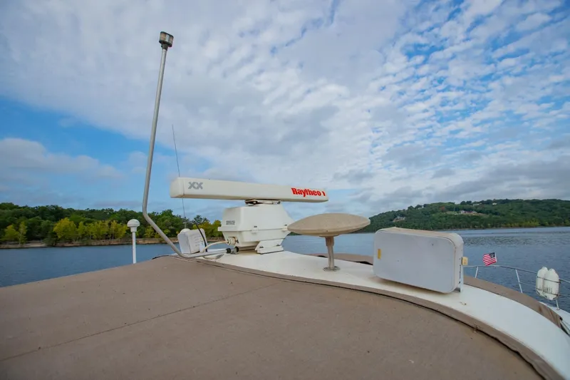 Just The Two Of Us Yacht Photos Pics 1997 Sea Ray 400 Sundancer boat with radar equipment on a scenic lake.