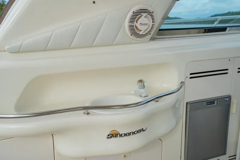 Just The Two Of Us Yacht Photos Pics 1997 Sea Ray 400 Sundancer yacht interior with sink and Pioneer speaker.