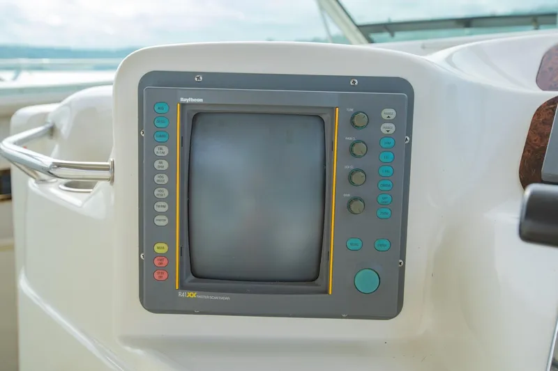 Just The Two Of Us Yacht Photos Pics 1997 Sea Ray 400 Sundancer boat control panel with Raytheon radar display.