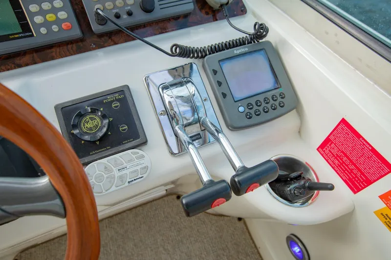 Just The Two Of Us Yacht Photos Pics 1997 Sea Ray 400 Sundancer helm with controls, navigation equipment, and steering wheel.
