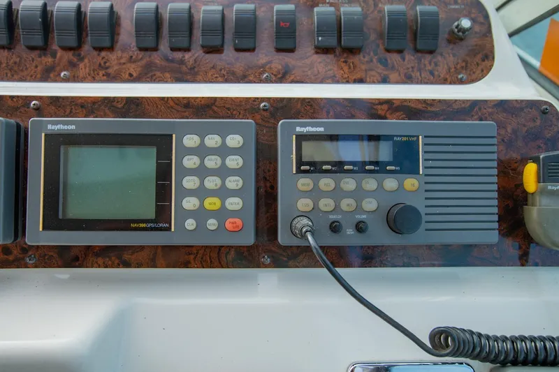 Just The Two Of Us Yacht Photos Pics Control panel of a 1997 Sea Ray 400 Sundancer with Raytheon navigation and communication systems.