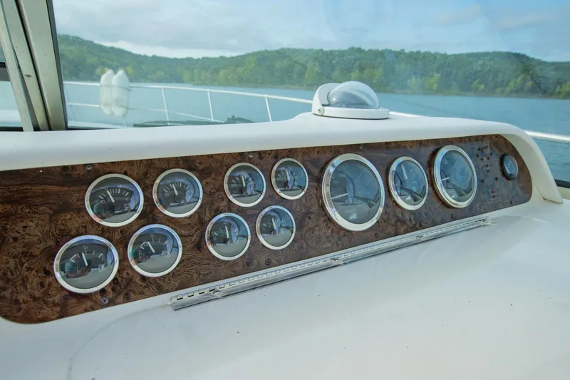 Just The Two Of Us Yacht Photos Pics Dashboard of a 1997 Sea Ray 400 Sundancer boat with multiple gauges.