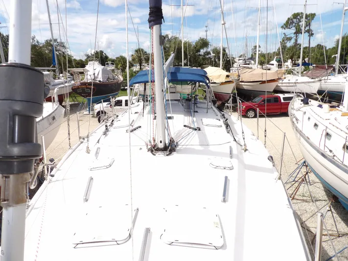 Summer Breeze Yacht Photos Pics Hunter 460 sailboat, 2000 model, docked in a marina with other boats.