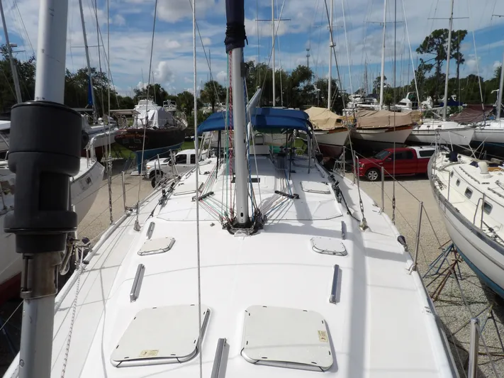 Summer Breeze Yacht Photos Pics Hunter 460 sailboat, 2000 model, docked in a marina with other boats.