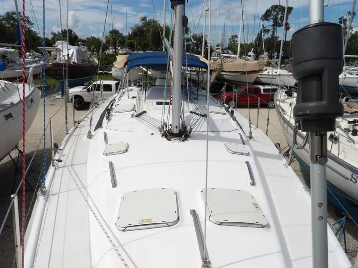 Summer Breeze Yacht Photos Pics Hunter 460 sailboat, 2000 model, docked in a marina with other boats.