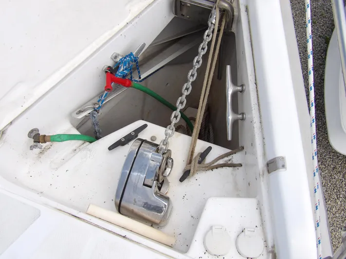 Summer Breeze Yacht Photos Pics Anchor locker of a 2000 Hunter 460 sailboat with chain and windlass.