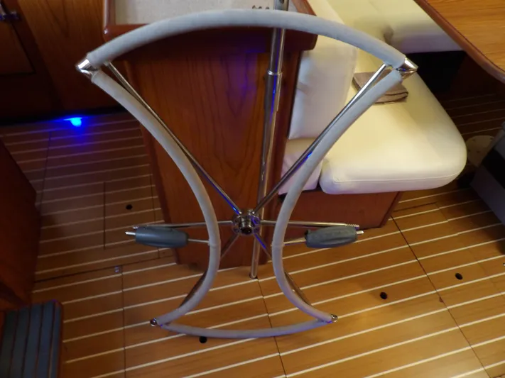 Summer Breeze Yacht Photos Pics Steering wheel of a 2000 Hunter 460 sailboat in the cabin.