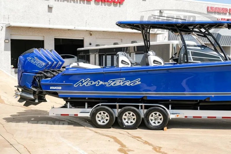  Yacht Photos Pics 2023 Nor-Tech 390 Sport Center Console boat in blue on a trailer.