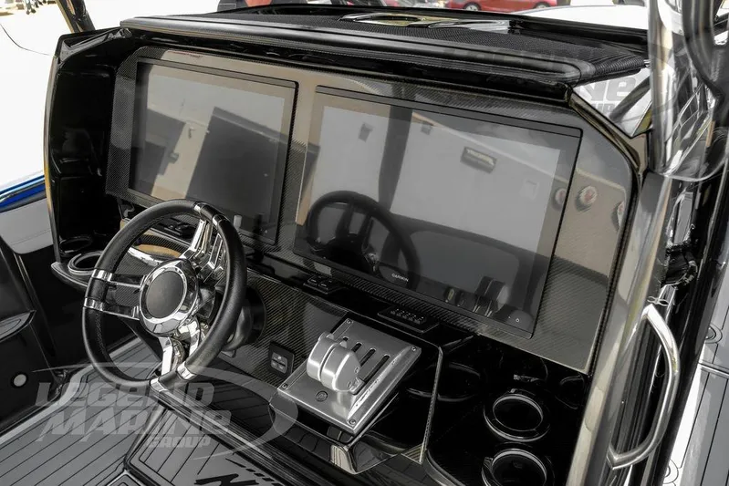  Yacht Photos Pics 2023 Nor-Tech 390 Sport Center Console dashboard with dual screens and steering wheel.
