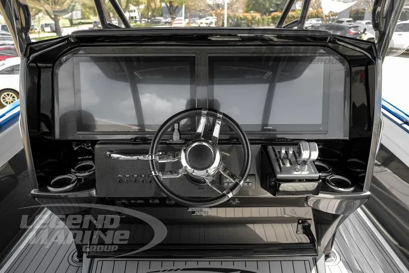  Yacht Photos Pics 2023 Nor-Tech 390 Sport Center Console dashboard with modern controls and dual screens.