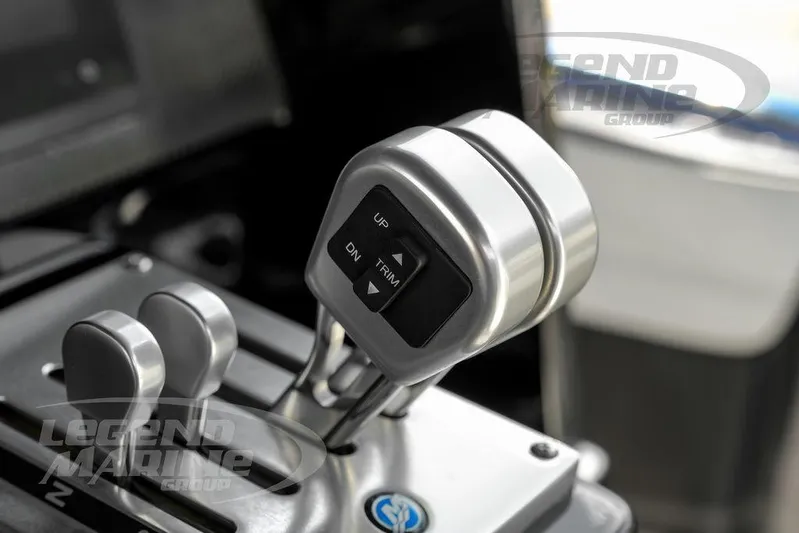  Yacht Photos Pics Throttle controls of 2023 Nor-Tech 390 Sport Center Console boat, featuring trim adjustment buttons.