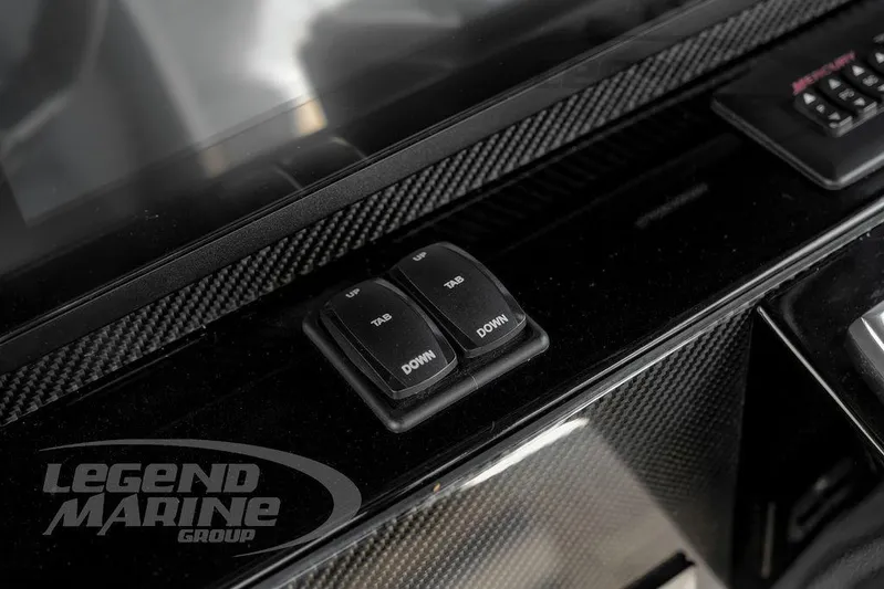  Yacht Photos Pics Control panel of 2023 Nor-Tech 390 Sport Center Console with carbon fiber accents.