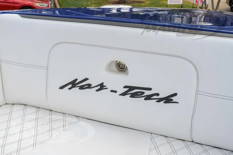  Yacht Photos Pics 2023 Nor-Tech 390 Sport Center Console, white seating with logo detail.