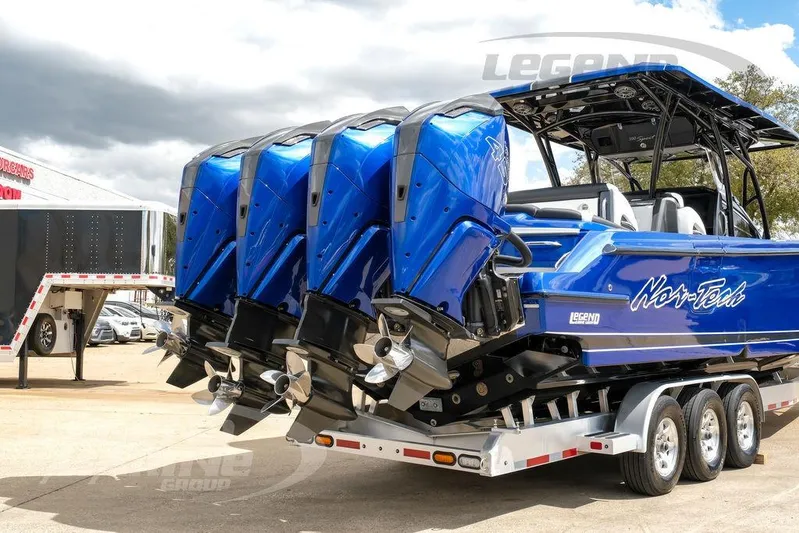  Yacht Photos Pics 2023 Nor-Tech 390 Sport Center Console boat with triple engines on a trailer.