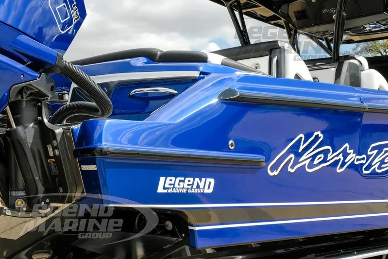  Yacht Photos Pics 2023 Nor-Tech 390 Sport Center Console in vibrant blue, featuring Legend Marine Group branding.
