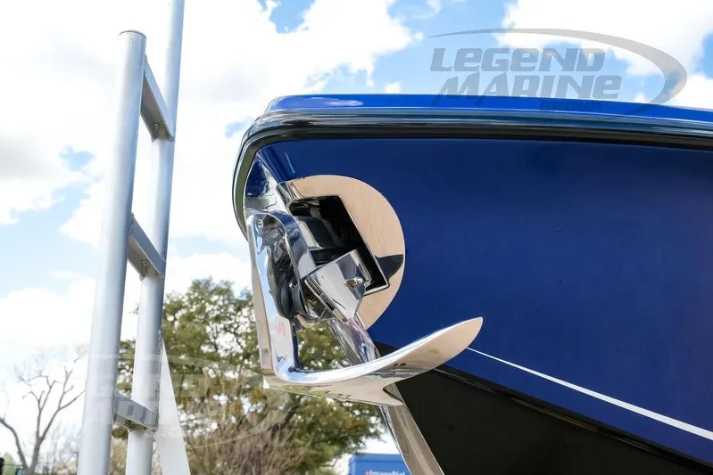  Yacht Photos Pics Close-up of 2023 Nor-Tech 390 Sport Center Console boat's sleek blue hull and anchor.