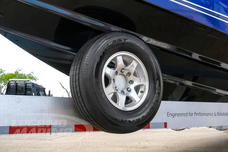  Yacht Photos Pics 2023 Nor-Tech 390 Sport Center Console on trailer, showcasing tire and hull detail.