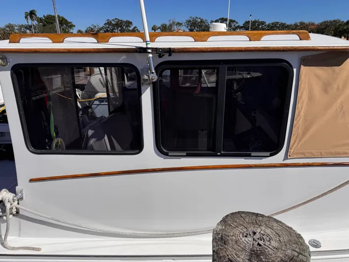 Grey Dawn Yacht Photos Pics 1987 West Bay James Beal 31 Hardtop Lobster Boat side view with windows and wooden trim.