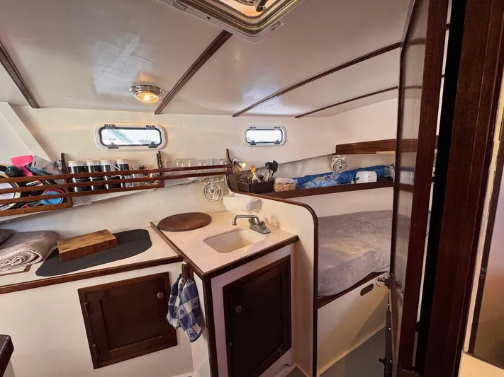 Grey Dawn Yacht Photos Pics Cozy cabin interior of 1987 West Bay James Beal 31 Hardtop Lobster Boat.