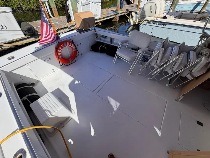 Grey Dawn Yacht Photos Pics 1987 West Bay James Beal 31 Hardtop Lobster Boat deck with chairs and life preserver.