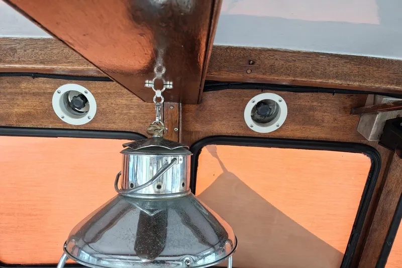 Grey Dawn Yacht Photos Pics Interior of 1987 West Bay James Beal 31 Hardtop Lobster Boat with vintage lantern.