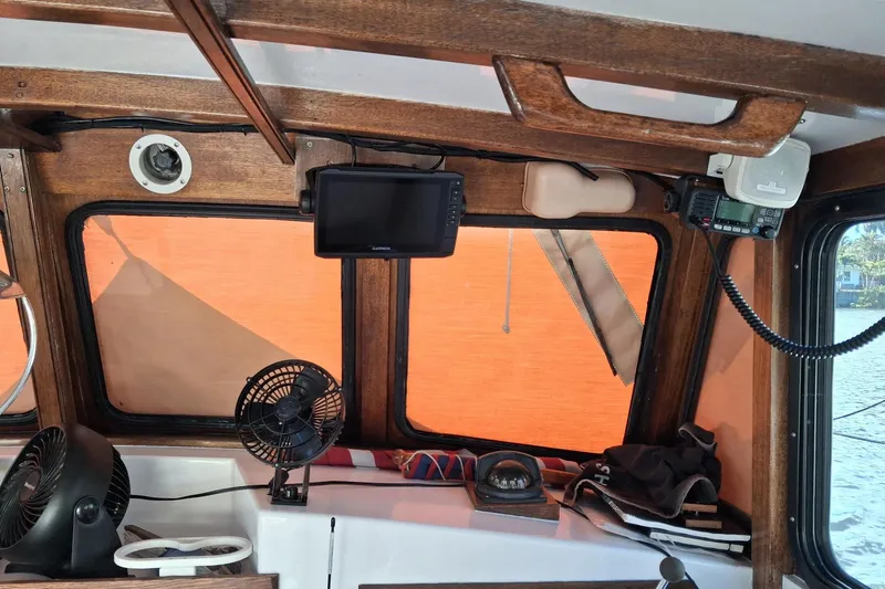 Grey Dawn Yacht Photos Pics Interior of 1987 West Bay James Beal 31 Hardtop Lobster Boat with navigation equipment.