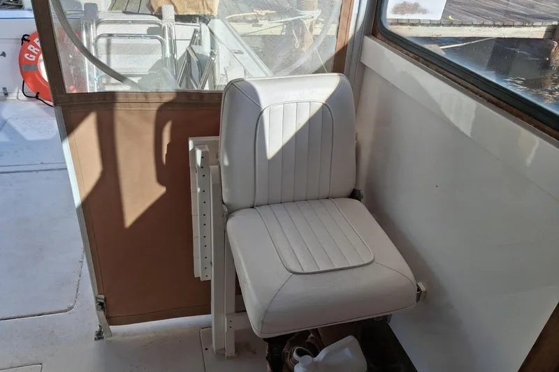 Grey Dawn Yacht Photos Pics Interior of 1987 West Bay James Beal 31 Hardtop Lobster Boat with white seat.