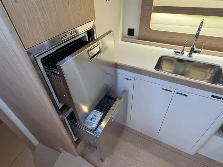  Yacht Photos Pics Modern kitchen in 2023 Beneteau First 53 yacht with stainless steel appliances.