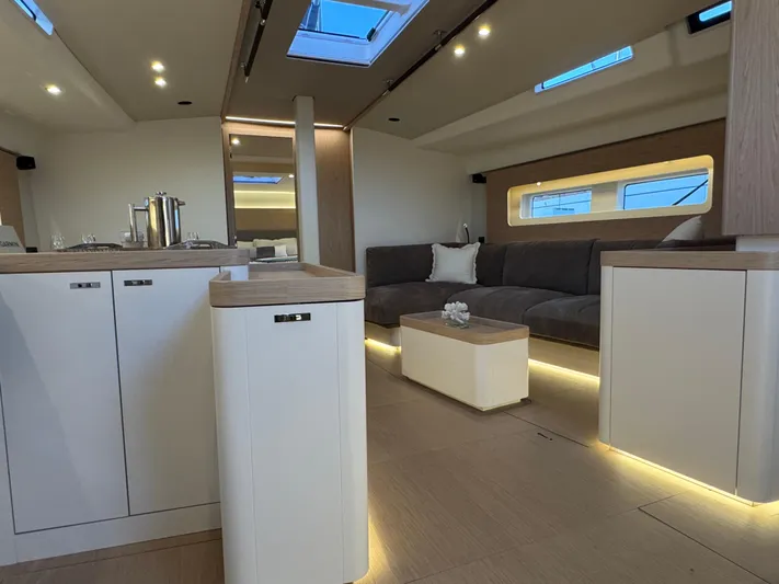  Yacht Photos Pics Luxurious interior of 2023 Beneteau First 53 yacht with modern design and ambient lighting.