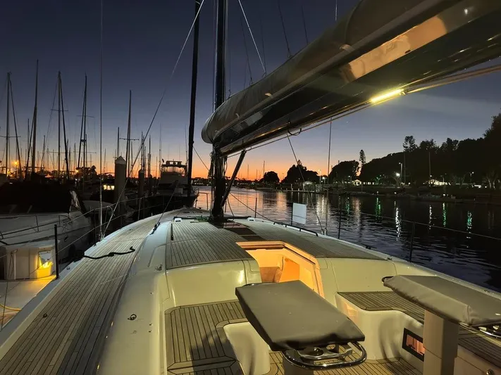  Yacht Photos Pics 2023 Beneteau First 53 yacht at sunset in marina, elegant deck view.
