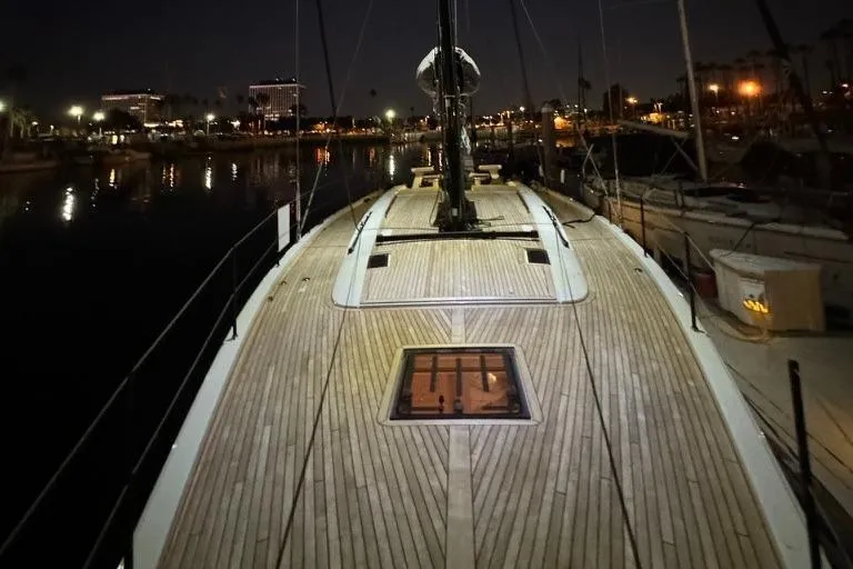  Yacht Photos Pics 2023 Beneteau First 53 yacht deck at night in marina.