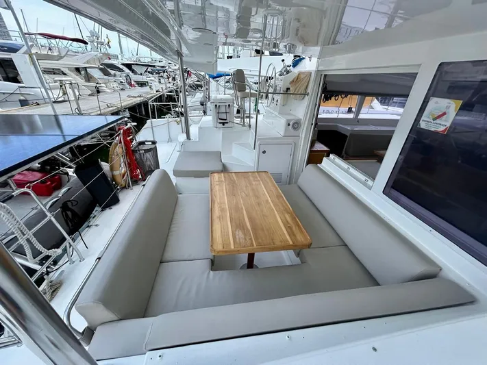  Yacht Photos Pics Spacious deck of 2010 Lagoon 400 catamaran with seating and wooden table.