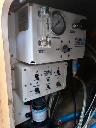  Yacht Photos Pics Watermaker control panel in a 2010 Lagoon 400 yacht, featuring pressure gauges and switches.