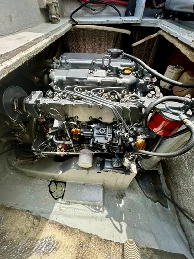  Yacht Photos Pics Engine compartment of a 2010 Lagoon 400 catamaran, showcasing detailed mechanical components.