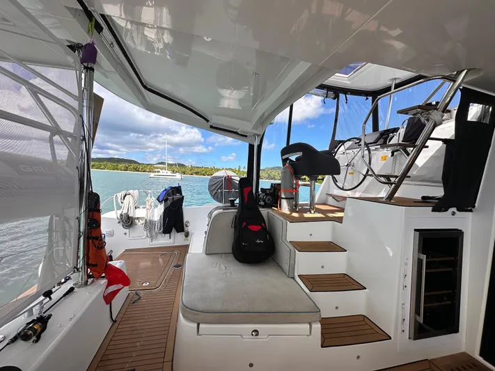  Yacht Photos Pics Interior view of 2023 Lagoon 42 catamaran with scenic ocean backdrop.