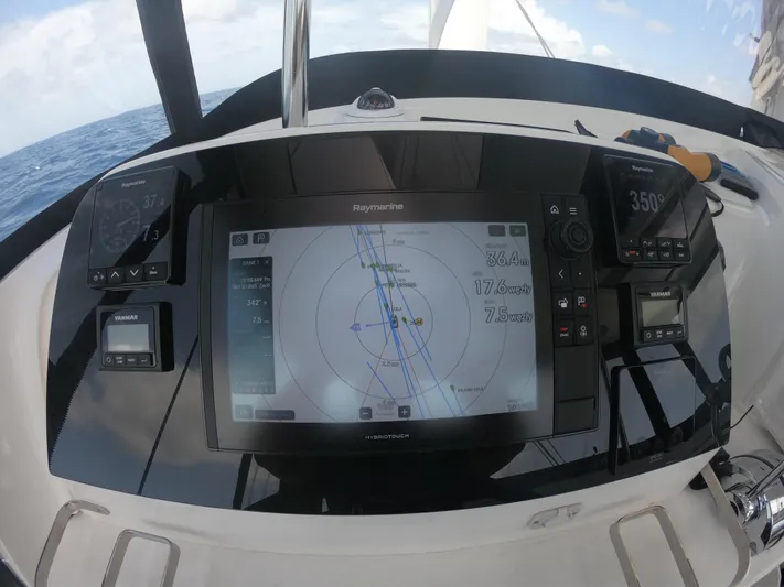  Yacht Photos Pics Helm of 2023 Lagoon 42 catamaran with navigation display and controls.