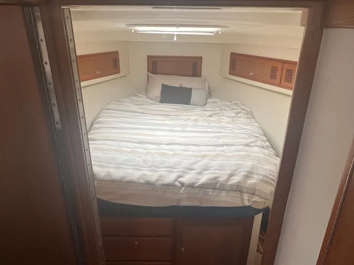  Yacht Photos Pics Interior of 2002 Cabo 35 Flybridge featuring a cozy bed.