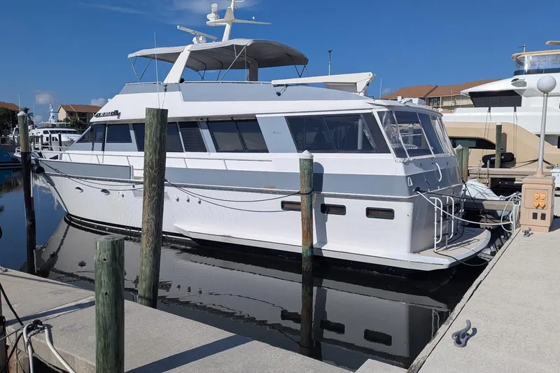  Yacht Photos Pics 1992 Viking 65 Motor Yacht docked at marina under clear blue sky.