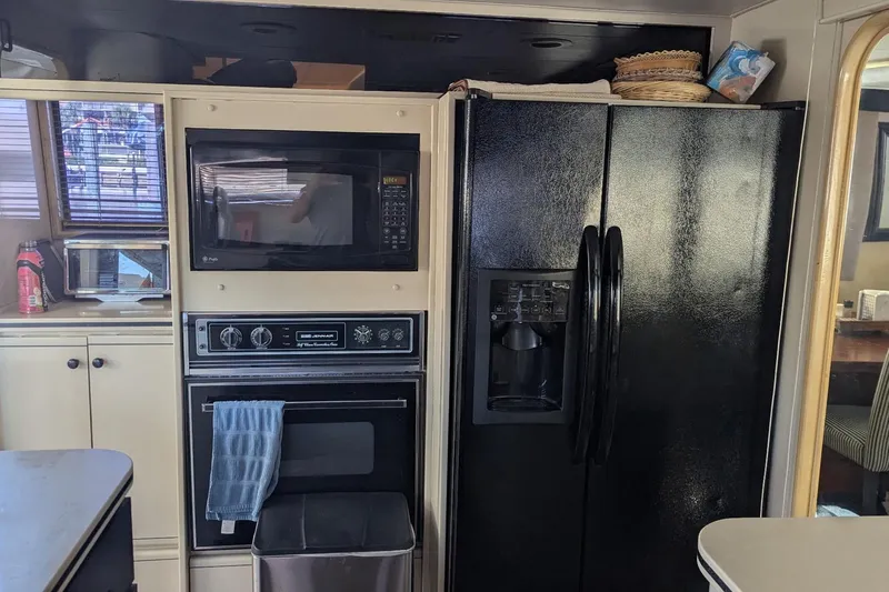  Yacht Photos Pics Kitchen area of a 1992 Viking 65 Motor Yacht with appliances and cabinetry.