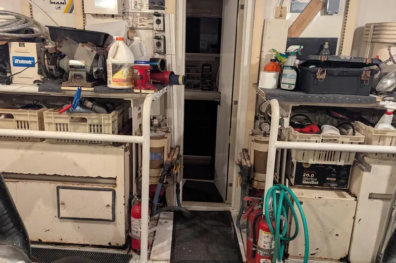  Yacht Photos Pics Engine room of a 1992 Viking 65 Motor Yacht with tools and equipment.