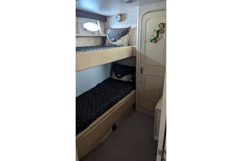  Yacht Photos Pics Cozy cabin with bunk beds in 1992 Viking 65 Motor Yacht.