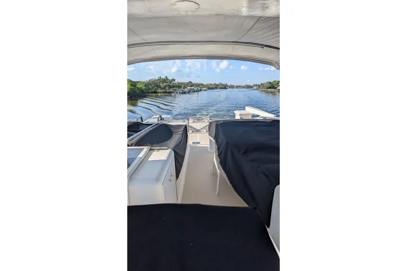  Yacht Photos Pics 1992 Viking 65 Motor Yacht interior view with scenic waterway backdrop.