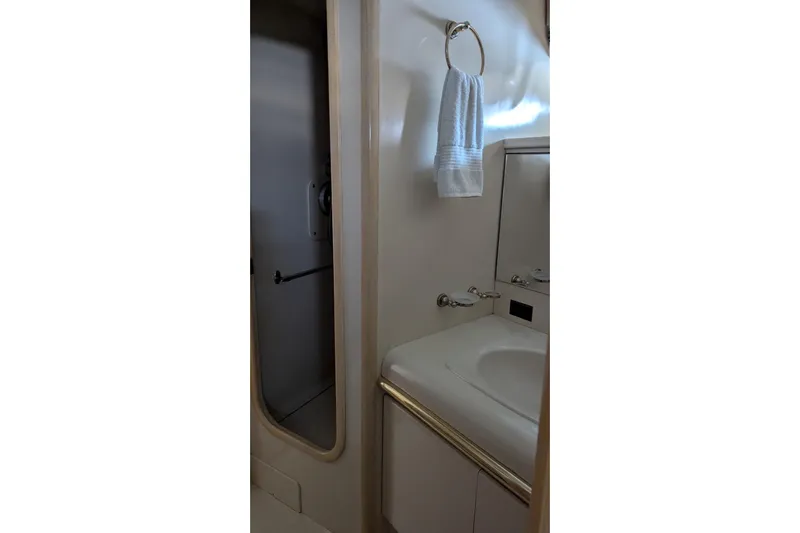  Yacht Photos Pics Bathroom interior of 1992 Viking 65 Motor Yacht with sink and towel.