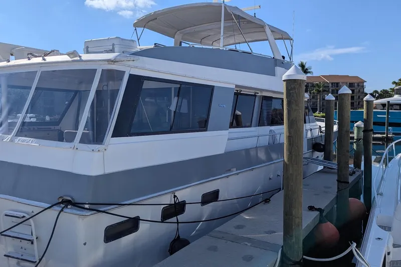  Yacht Photos Pics 1992 Viking 65 Motor Yacht docked at marina under clear blue sky.